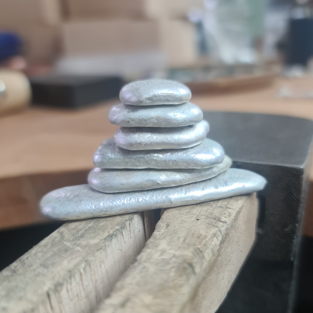 a small pile of silver ingots